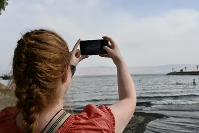 girl taking picture on phone